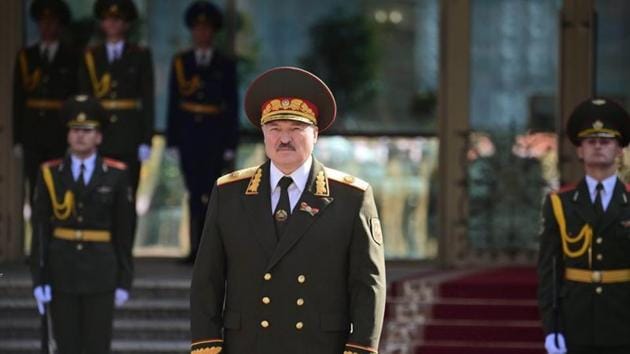 Belarusian President Alexander Lukashenko stands near service members during an inauguration ceremony in Minsk, Belarus September 23, 2020.(via REUTERS)