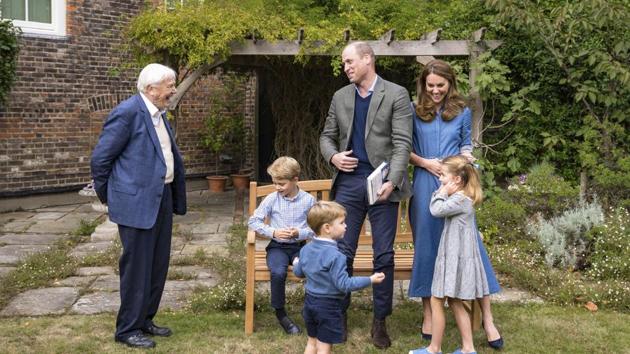 The photo shows members of royal family with Naturalist David Attenborough.(AP)