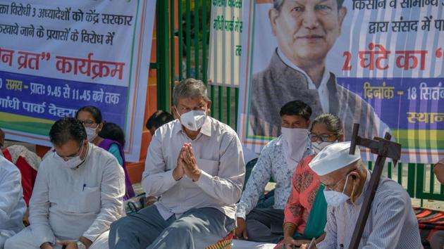 In this file photo from Sept. 18, 2020, Congress General Secretary Harish Rawat along with party workers keeps a two-hour silent fast during a protest over agriculture related ordinances, in Dehradun.(PTI) In this file photo from Sept. 18, 2020, Congress General Secretary Harish Rawat along with party workers keeps a two-hour silent fast during a protest over agriculture related ordinances, in Dehradun.(PTI)