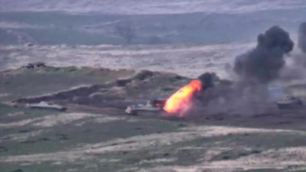 A still image from a video released by the Armenian Defence Ministry shows what is said to be Azerbaijani armoured vehicles, one of which is destroyed by Armenian armed forces in the breakaway region of Nagorno-Karabakh.(via REUTERS)
