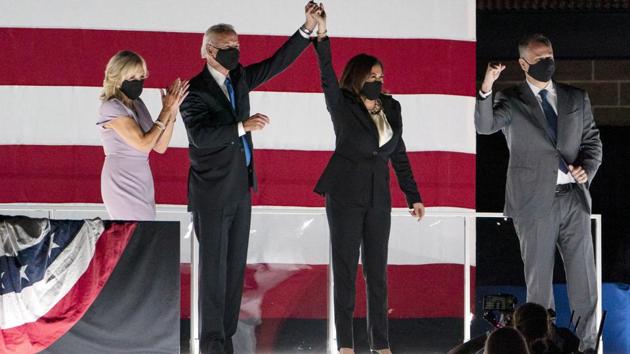 Democratic presidential candidate and former Vice President Joe Biden (2L) and his wife, Jill Biden (L), and vice presidential candidate Sen. Kamala Harris (2R), and her husband, Douglas Emhoff, during the Democratic National Convention on August 20. Biden, 77, leads in polls against the Republican incumbent, both nationwide and in most of the crucial swing states set to provide the decisive electoral college count on November 3. (Carolyn Kaster / AP) Democratic presidential candidate and former Vice President Joe Biden (2L) and his wife, Jill Biden (L), and vice presidential candidate Sen. Kamala Harris (2R), and her husband, Douglas Emhoff, during the Democratic National Convention on August 20. Biden, 77, leads in polls against the Republican incumbent, both nationwide and in most of the crucial swing states set to provide the decisive electoral college count on November 3. (Carolyn Kaster / AP)