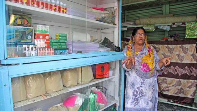 Rahima Iqubal Shaikh, a shopkeeper of antim-kriya vidhi kit (kit for final rites) at her shop in Ganj peth.(Ravindra Joshi/HT PHOTO)