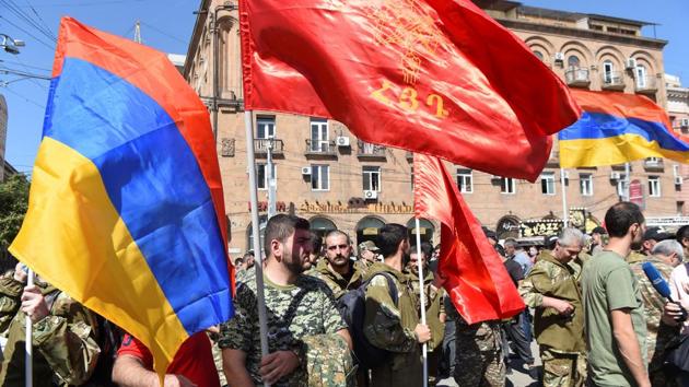 People attend a meeting to recruit military volunteers after Armenian authorities declared martial law and mobilised its male population following clashes with Azerbaijan over the breakaway Nagorno-Karabakh region in Yerevan, Armenia.(REUTERS) People attend a meeting to recruit military volunteers after Armenian authorities declared martial law and mobilised its male population following clashes with Azerbaijan over the breakaway Nagorno-Karabakh region in Yerevan, Armenia.(REUTERS)