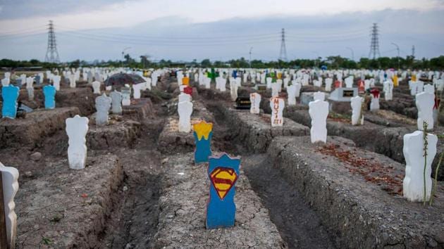 A view of a burial site for people who died of coronavirus disease (Covid-19) at Keputih cemetery in Surabaya, Indonesia on September 26. Deaths due to Covid-19 around the world crossed the 1 million mark on September 27. (Juni Kriswanto / AFP)