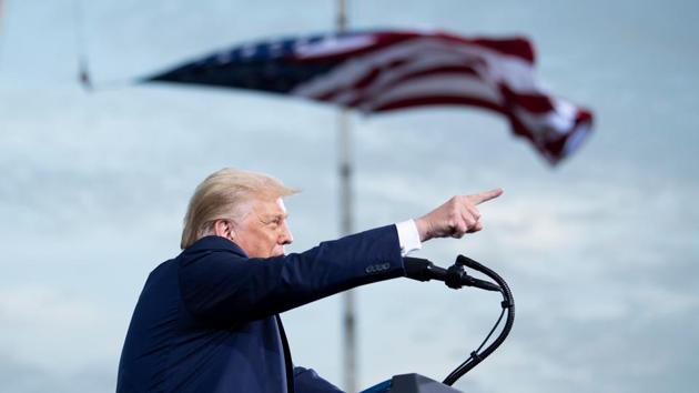 The American flag flies at half-mast in honour of the late Justice Ruth Bader Ginsburg as US President Donald Trump speaks during a campaign rally at Cecil Airport on September 24, in Jacksonville, Florida. The volatile US presidential election enters a fierce new stage this week when Donald Trump and Joe Biden hold their first debate -- a television spectacle finally allowing Americans to witness the two antagonists head to head. (Brendan Smialowski / AFP) The American flag flies at half-mast in honour of the late Justice Ruth Bader Ginsburg as US President Donald Trump speaks during a campaign rally at Cecil Airport on September 24, in Jacksonville, Florida. The volatile US presidential election enters a fierce new stage this week when Donald Trump and Joe Biden hold their first debate -- a television spectacle finally allowing Americans to witness the two antagonists head to head. (Brendan Smialowski / AFP)