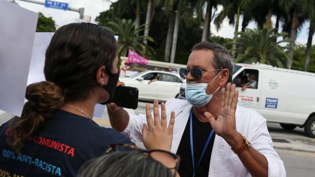 A supporter of Joe Biden (L) argues with a supporter of incumbent US President Donald Trump during a rally outside the “Latinos for Trump Roundtable” event in Doral, Florida, on September 25. Trump needs to break through the bad news of 200,000 coronavirus deaths, the long-lasting economic fallout, and fatigue among swaths of the country at the constant scandal and upheaval roiling his administration. (Marco Bello / AFP) A supporter of Joe Biden (L) argues with a supporter of incumbent US President Donald Trump during a rally outside the “Latinos for Trump Roundtable” event in Doral, Florida, on September 25. Trump needs to break through the bad news of 200,000 coronavirus deaths, the long-lasting economic fallout, and fatigue among swaths of the country at the constant scandal and upheaval roiling his administration. (Marco Bello / AFP)
