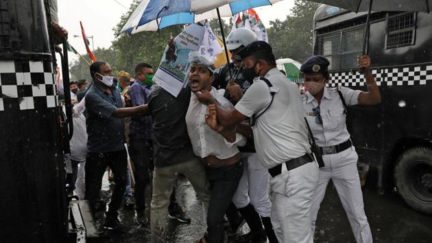A Congress party supporter is detained by police during a protest against new farm laws in Kolkata on September 28. West Bengal chief minister and Trinamool Congress (TMC)Chief Mamata Banerjee also condemned the agriculture reforms and compared the destructive nature of the bills to the Bengal famine of 1943 which claimed more than two million lives. (Rupak De Chowdhuri / REUTERS) A Congress party supporter is detained by police during a protest against new farm laws in Kolkata on September 28. West Bengal chief minister and Trinamool Congress (TMC)Chief Mamata Banerjee also condemned the agriculture reforms and compared the destructive nature of the bills to the Bengal famine of 1943 which claimed more than two million lives. (Rupak De Chowdhuri / REUTERS)