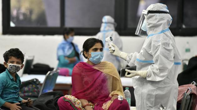 A health worker checks vitals of a patient at a Covid-19 Care Centre in New Delhi on September 27. India has had the worst Covid-19 outbreak in the world since the first week of August, accounting for more than a quarter of all recorded infections since then. (Sanjeev Verma / HT Photo) A health worker checks vitals of a patient at a Covid-19 Care Centre in New Delhi on September 27. India has had the worst Covid-19 outbreak in the world since the first week of August, accounting for more than a quarter of all recorded infections since then. (Sanjeev Verma / HT Photo)
