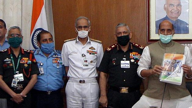 Defence Minister Rajnath Singh, Air Force Chief Air Chief Marshal RKS Bhadauria, Chief of Defence Staff (CDS) General Bipin Rawat, Chief of the Naval Staff Admiral Karambir Singh and Chief of the Indian Army M.M Naravane during the unveiling of the new Defence Acquisition Procedure (DAP)-2020 Document, in New Delhi on Monday.(ANI)