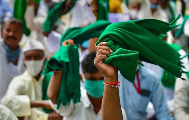 Farmers protest against the passage of new farm bills in the Parliament and land legislations proposed by the Karnataka government, in Bengaluru, Tuesday, Sept. 22, 2020. (PTI Photo/Shailendra Bhojak)