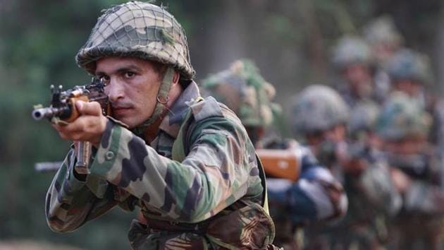 Army soldiers take positions during their patrol near the Line of Control in Nowshera sector, about 90 kilometers from Jammu.(AP File Photo)