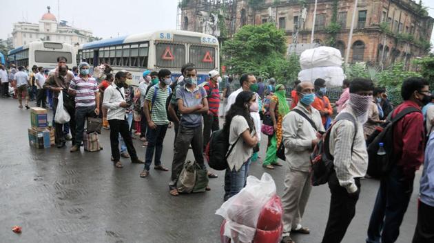 Passengers wait to board buses to reach their destination, during Unlock 4, at Esplanade in Kolkata (PTI Photo)