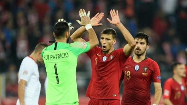 Portugal's Rui Patricio and Ruben Dias celebrate.(REUTERS)