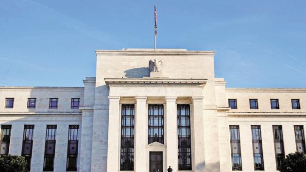 A police officer keeps watch in front of the US Federal Reserve in Washington.(Reuters File Photo)