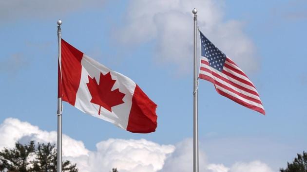 A US and a Canadian flag flutter at the Canada-United States border crossing at the Thousand Islands Bridge, which remains closed to non-essential traffic to combat the spread of the coronavirus disease (Covid-19) in Lansdowne, Ontario.(REUTERS) A US and a Canadian flag flutter at the Canada-United States border crossing at the Thousand Islands Bridge, which remains closed to non-essential traffic to combat the spread of the coronavirus disease (Covid-19) in Lansdowne, Ontario.(REUTERS)