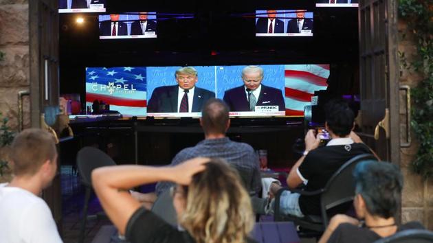 People watch a broadcast of the first 2020 US presidential debate at The Abbey in West Hollywood, California on September 29. Trump bulldozed his way through the 90-minute debate, trying to goad Biden, claiming that Democrats were trying to steal the November presidential election, Reuters reported. (Mario Tama / AFP)