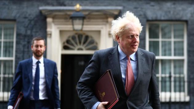 Britain's Prime Minister Boris Johnson walks outside Downing Street in London, Britain.(REUTERS)