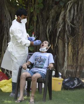 A health worker collecting a swab sample for Covid testing at Gurugram on Wednesday.(Parveen Kumar/HT) A health worker collecting a swab sample for Covid testing at Gurugram on Wednesday.(Parveen Kumar/HT)