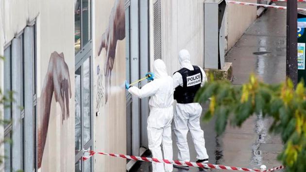 Forensic experts investigate the scene of an incident near the former offices of French magazine Charlie Hebdo, in Paris.(REUTERS) Forensic experts investigate the scene of an incident near the former offices of French magazine Charlie Hebdo, in Paris.(REUTERS)