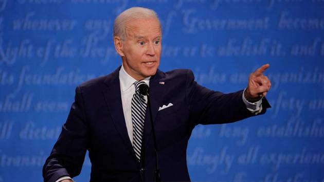 The pandemic’s effects were in plain sight, with the candidates’ lecterns spaced far apart, all of the guests in the small crowd tested and the traditional opening handshake scrapped.(REUTERS) The pandemic’s effects were in plain sight, with the candidates’ lecterns spaced far apart, all of the guests in the small crowd tested and the traditional opening handshake scrapped.(REUTERS)