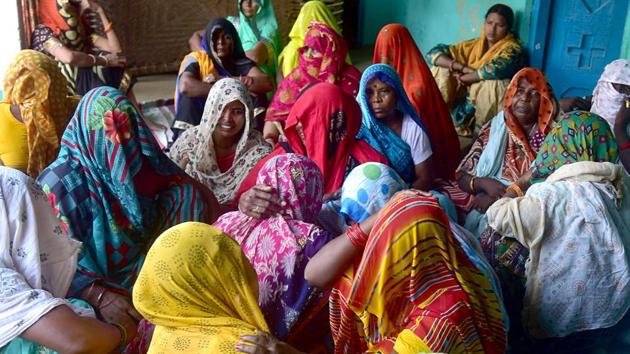 Relatives of the rape victim mourn her death, at her village in Uttar Pradesh’s Hathras district.(ANI)