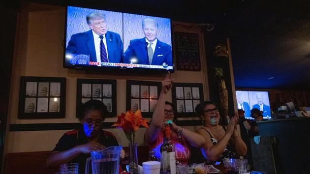 Women for Trump cheer for the president at a "Debate Watch Party" during the Presidential debate between US President Donald Trump and Democratic Presidential candidate Joe Biden, in the City of Industry, California.(REUTERS)