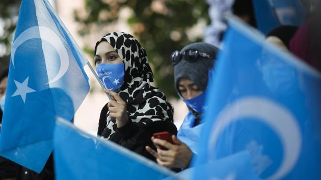 Uyghurs women take part in a protest during the visit of Chinese Foreign Minister Wang Yi in Berlin, Germany, Tuesday, Sept. 1, 2020.(AP photo)