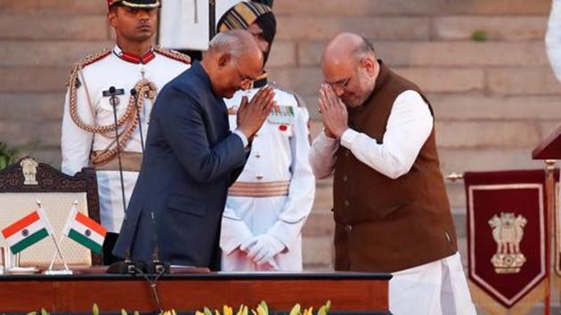 India's President Ram Nath Kovind greets Amit Shah after his oath of office during a swearing-in ceremony at the presidential palace in New Delhi.(REUTERS)