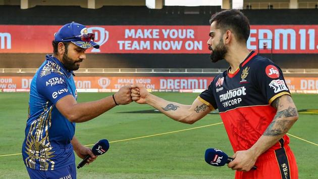 Dubai: Royal Challengers Bangalore captain Virat Kohli (R) and Mumbai Indians captain Rohit Sharma after the toss during the Indian Premier League 2020 cricket match, at Dubai International Cricket Stadium, Dubai, Monday, Sept. 28, 2020. (Representational image) (PTI)
