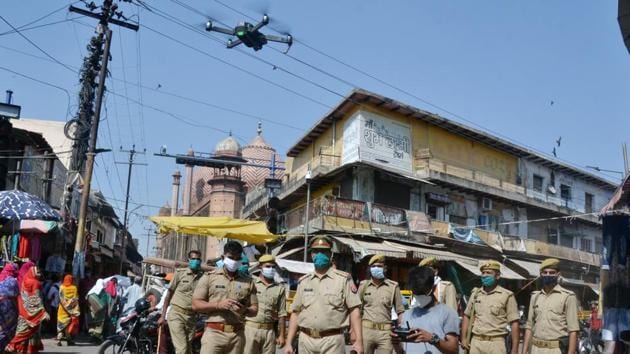 Police personnel stands guard and uses drone to check the area around Jama Masjid in Agra on Wednesday, as the all accused acquitted in the Babri Masjid demolition case by the Special CBI Court in Lucknow.(ANI)
