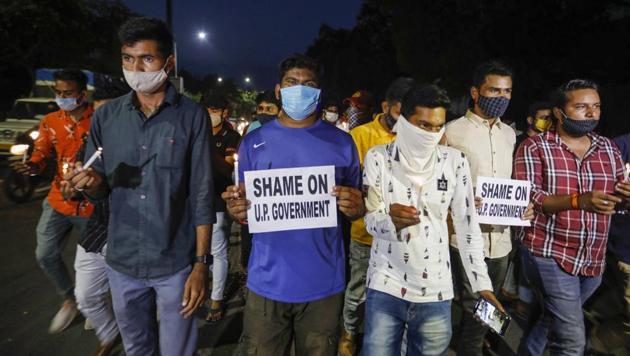 National Students' Union of India (NSUI) activists hold a candlelight march to pay homage to Hathras gang-rape victim, in front of Gujarat University in Ahmedabad. (PTI) National Students' Union of India (NSUI) activists hold a candlelight march to pay homage to Hathras gang-rape victim, in front of Gujarat University in Ahmedabad. (PTI)