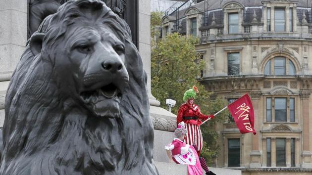Actors dressed as pantomime dames protest at Trafalgar Square as they march on Parliament to demand more support for the theatre sector amid the COVID-19 pandemic in London, Wednesday, Sept. 30, 2020. (AP)