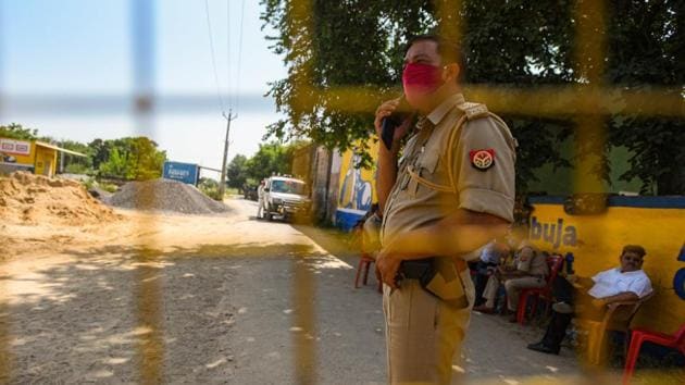 The Hathras administration has deployed scores of police personnel in and around the village of the young Dalit woman who died a fortnight after she was allegedly gang-raped by four so-called upper caste men(HT Photo/Amal KS)