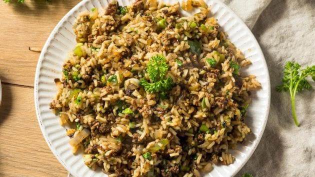Dirty rice.  Spicy, and named because finely chopped chicken liver and ground beef or pork stain rice.  Cajun communities often serve it as a dry side dish.  (SHUTTER STOCK)