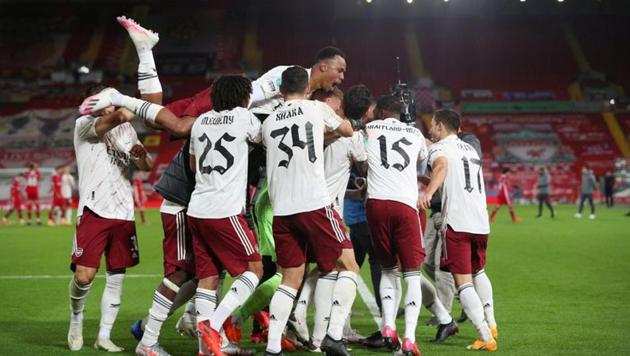 Arsenal celebrate winning the penalty shootout.(Pool via REUTERS)