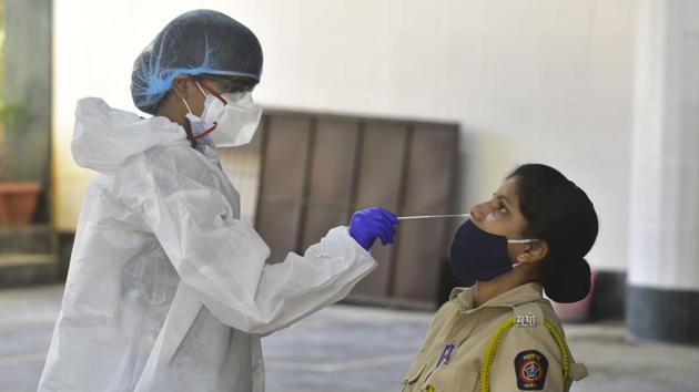 BMC medical staff conducts a swab test on police personnel posted at Shivaji Park Police station,in Mumbai, on September 8. (Anshuman Poyrekar/HT Photo) BMC medical staff conducts a swab test on police personnel posted at Shivaji Park Police station,in Mumbai, on September 8. (Anshuman Poyrekar/HT Photo)