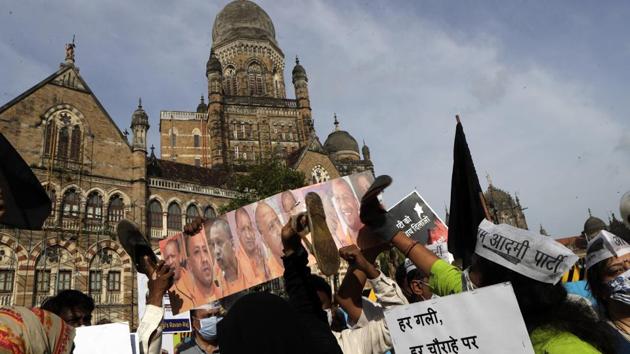 Activists protest against the Hathras crime incident as they beat an effigy of Uttar Pradesh Chief Minister Yogi Adityanath in Mumbai on October 1. Raising questions over the law and order situation in Uttar Pradesh, Bahujan Samajwadi Party chief Mayawati on October 1 demanded in a press conference that either the state’s chief minister be replaced or the President’s rule imposed in Uttar Pradesh, PTI reported. (Rajanish Kakade / AP) Activists protest against the Hathras crime incident as they beat an effigy of Uttar Pradesh Chief Minister Yogi Adityanath in Mumbai on October 1. Raising questions over the law and order situation in Uttar Pradesh, Bahujan Samajwadi Party chief Mayawati on October 1 demanded in a press conference that either the state’s chief minister be replaced or the President’s rule imposed in Uttar Pradesh, PTI reported. (Rajanish Kakade / AP)
