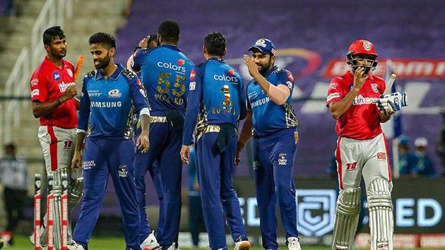 Mumbai Indians and Kings XI Punjab players shake hands after the match was over during the Indian Premier League 2020.(PTI)