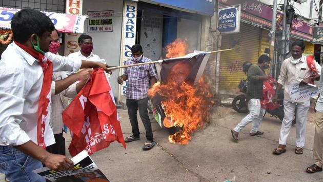 Members of All-India Agricultural Workers Union (AIAWU) and All India Kisan Sabha (AIKS) burn a poster during a protest against the death of a 19-year-old Dalit woman from Hathras in Hyderabad on October 1. (PTI) Members of All-India Agricultural Workers Union (AIAWU) and All India Kisan Sabha (AIKS) burn a poster during a protest against the death of a 19-year-old Dalit woman from Hathras in Hyderabad on October 1. (PTI)