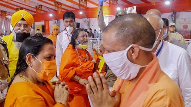 Uttar Pradesh Chief Minister Yogi Adityanath being greeted by BJP leader Uma Bharti during the function ahead of the inception of Bhoomi Pujan for the construction of Ram Temple, in Ayodhya.(PTI)