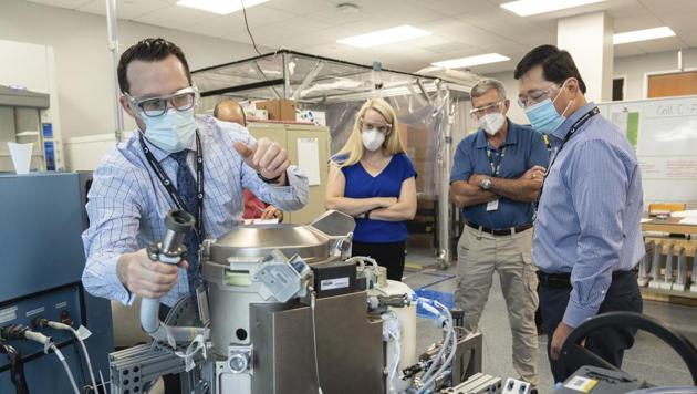 In this June 18, 2020 photo provided by NASA, astronaut Kate Rubins, center, and support personnel review the Universal Waste Management System, a low-gravity space toilet, in Houston (Norah Moran/NASA via AP) In this June 18, 2020 photo provided by NASA, astronaut Kate Rubins, center, and support personnel review the Universal Waste Management System, a low-gravity space toilet, in Houston (Norah Moran/NASA via AP)