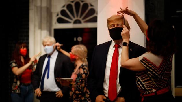 Artists put the finishing touches to wax figures Britain's Prime Minister Boris Johnson and US President Donald Trump as Madame Tussauds prepares to reopen its doors to the public on July 30, 2020.(AFP File) Artists put the finishing touches to wax figures Britain's Prime Minister Boris Johnson and US President Donald Trump as Madame Tussauds prepares to reopen its doors to the public on July 30, 2020.(AFP File)