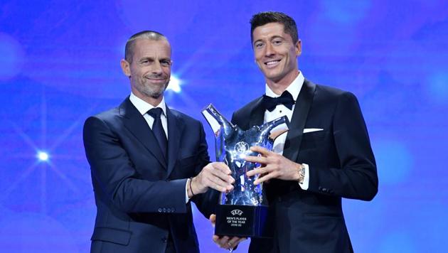 Bayern Munich's Robert Lewandowski after winning the Player of the year with UEFA President Aleksander Ceferin.(REUTERS) Bayern Munich's Robert Lewandowski after winning the Player of the year with UEFA President Aleksander Ceferin.(REUTERS)