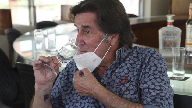 Johnny Schuler, a Pisco producer and owner of La Caravedo vineyard, tests his Porton Pisco brand at his office in the desert city of Ica, Peru, Monday, Sept. 28, 2020. More than 500 Pisco producers have seen their sales collapse by half and thousands of grape growers have had their fields ruined because of the late harvests, because of the strict lockdown implemented to stop COVID-19. (AP) Johnny Schuler, a Pisco producer and owner of La Caravedo vineyard, tests his Porton Pisco brand at his office in the desert city of Ica, Peru, Monday, Sept. 28, 2020. More than 500 Pisco producers have seen their sales collapse by half and thousands of grape growers have had their fields ruined because of the late harvests, because of the strict lockdown implemented to stop COVID-19. (AP)