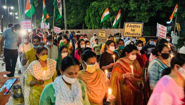People stage a candle march over the death of a 19-year-old Dalit woman who was allegedly gang-raped in Hathras, in Hisar. Another case of police inaction has surfaced in Narsinghpur, Madhya Pradesh where a Dalit woman died by suicide and her kin complained cops did not take requisite action after complaint was registered. (PTI Photo) People stage a candle march over the death of a 19-year-old Dalit woman who was allegedly gang-raped in Hathras, in Hisar. Another case of police inaction has surfaced in Narsinghpur, Madhya Pradesh where a Dalit woman died by suicide and her kin complained cops did not take requisite action after complaint was registered. (PTI Photo)