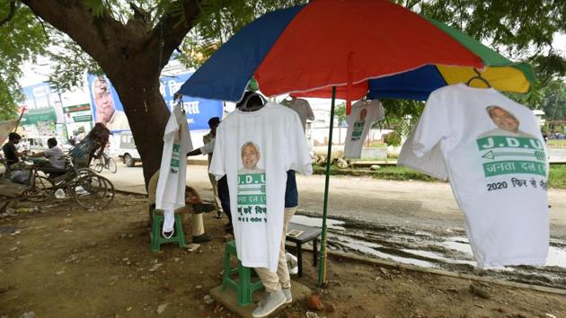 A hawker selling T-shirts with Bihar Chief Minister and Janata Dal United national president Nitish Kumar’s face printed on them outside party office, in Patna, Bihar.(Santosh Kumar/ Hindustan Times)