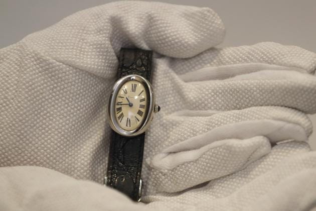 A Cartier wristwatch,1966, owned by Beatles manager Brian Epstein is displayed at Sotheby's auction rooms in London, Friday, Sept. 25, 2020. The watch is estimated at 15,000-20,000 UK pounds (18,663-24,884 US dollars). (AP)