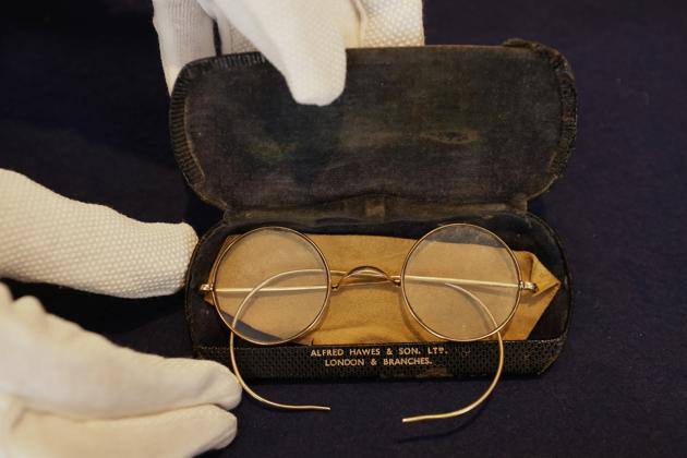 A pair of round Windsor spectacles that belonged to John Lennon are displayed at Sotheby's auction rooms in London, Friday, Sept. 25, 2020. The glasses are estimated at 30,000-40,000 UK pounds (38,155-50,873 US dollars). (AP)