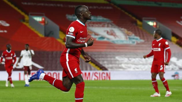 Liverpool's Sadio Mane celebrates after scoring his team's first goal during the English Premier League soccer match between Liverpool and Arsenal at Anfield.(AP)