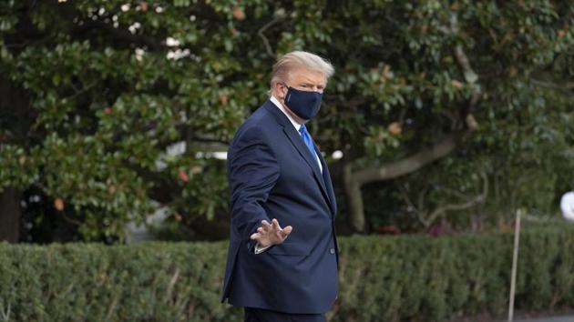 President Donald Trump waves as he leaves the White House to go to Walter Reed National Military Medical Center after he tested positive for Covid-19. (AP) President Donald Trump waves as he leaves the White House to go to Walter Reed National Military Medical Center after he tested positive for Covid-19. (AP)